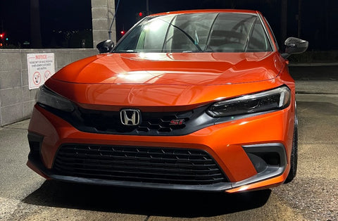 Front view of orange 11th generation honda civic si