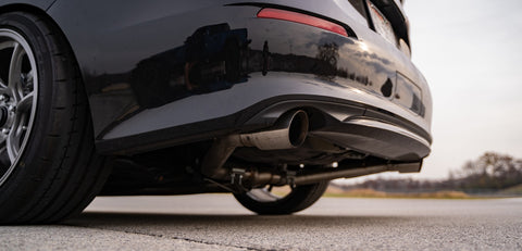 Isolated view of exhaust kit on eleventh-generation Honda Civic Si